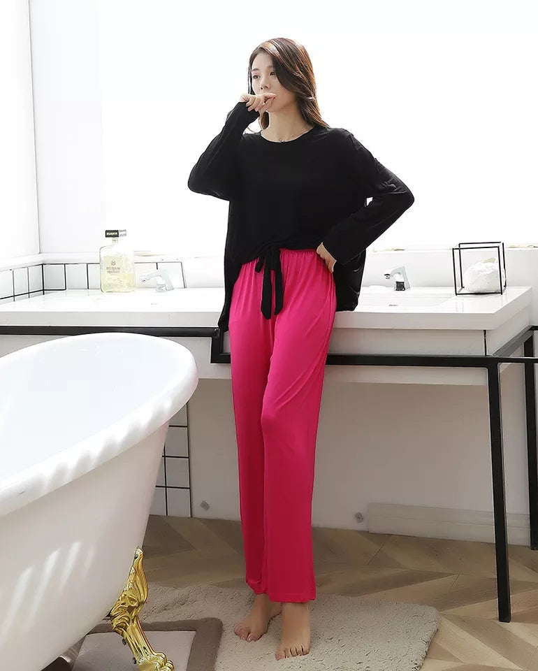 a woman standing next to a white toilet 