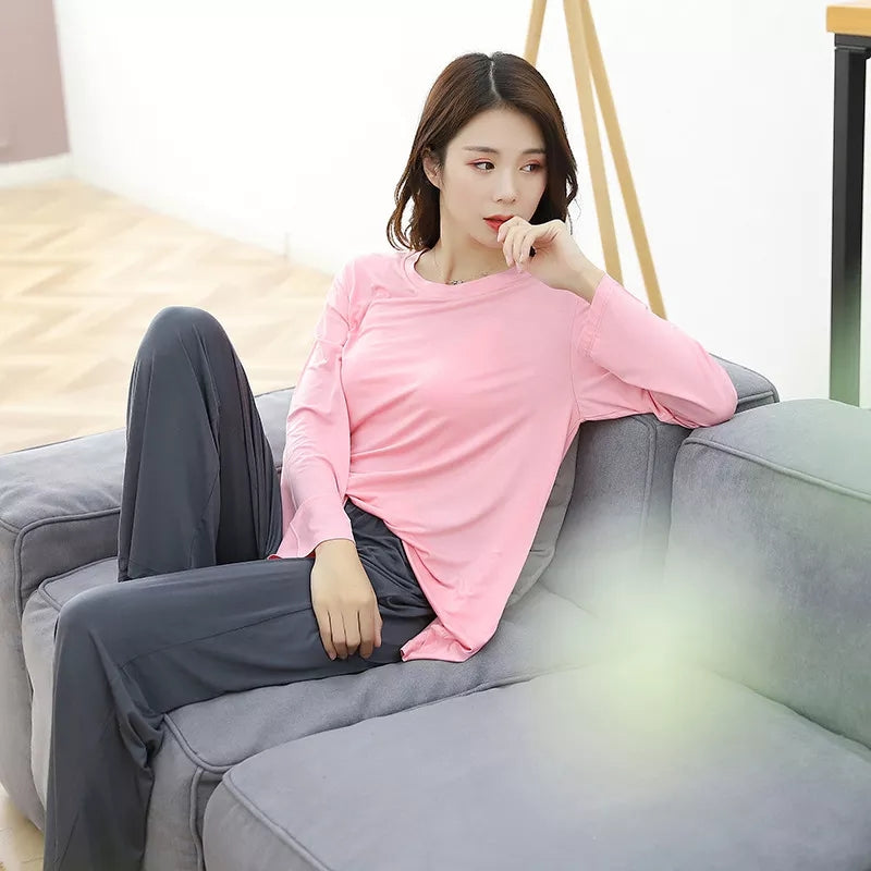 a girl is sitting on a blue couch 