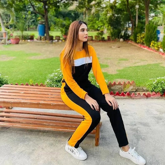 a woman riding a skateboard on a park bench 