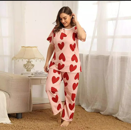 a woman in a dress standing in a bathroom 