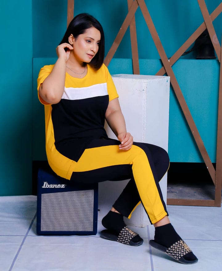 a woman sitting on a chair holding a laptop 