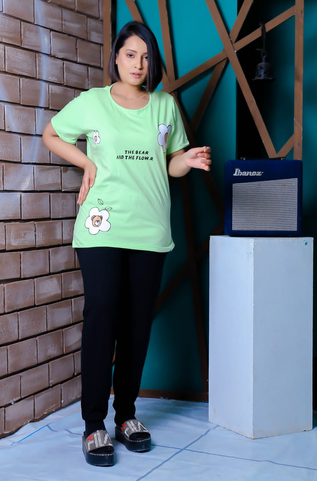 a man and a woman standing next to a refrigerator 